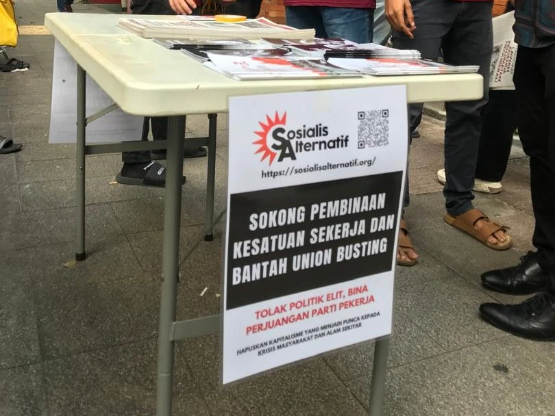 The Pointless Debate over Bumiputera Quotas Between Racists and Meritocrats 18 2025 04 28 sepanduk pekerja kenyataan hari buruh 2025 sosialis alternatif The Pointless Debate over Bumiputera Quotas Between Racists and Meritocrats Sosialis Alternatif