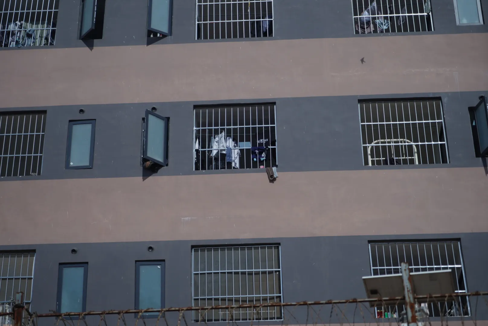 Scam Slavery in the Death Agony of Capitalism 13 Where the “scammers” are housed, cramped flats often come equipped with caged balconies or barred windows to prevent escape if not suicide. (Source: Blue Dragon)