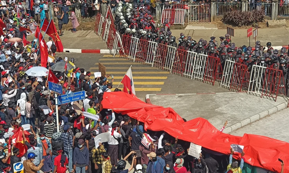 Myanmar’s 2025–26 ‘Sham Election’ 1 Anti-coup protesters rally in Yangon, Myanmar, on 9 February 2021.