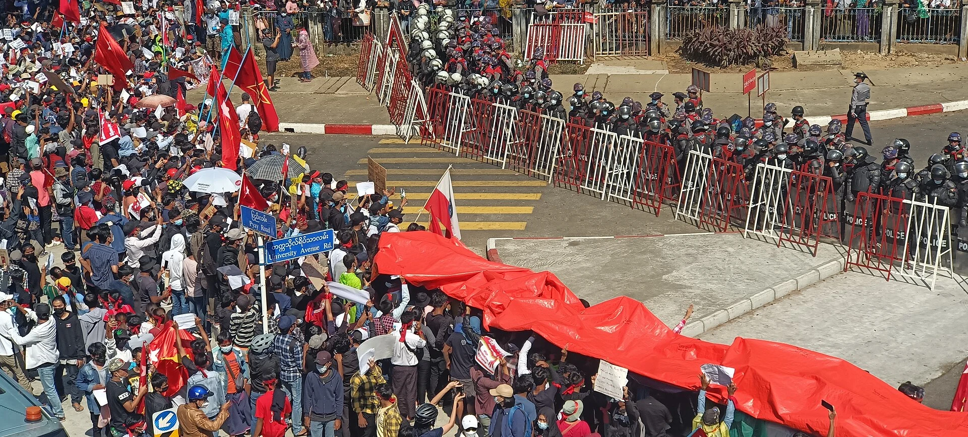 Myanmar’s 2025–26 ‘Sham Election’ 1 Anti-coup protesters rally in Yangon, Myanmar, on 9 February 2021.